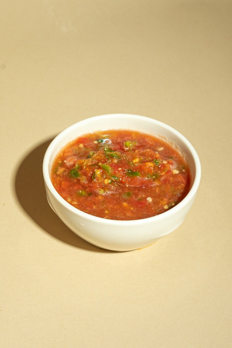 A bowl of soup is sitting on a table