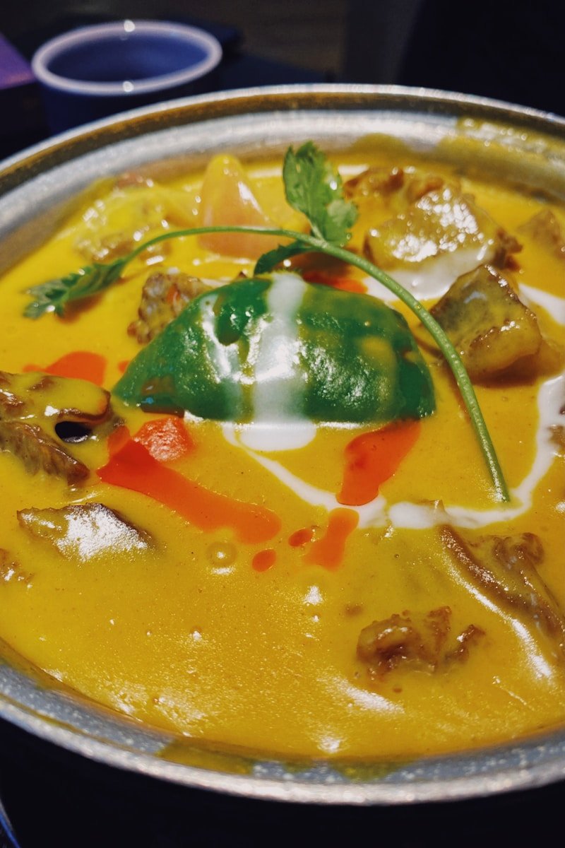 soup with vegetables on stainless steel bowl