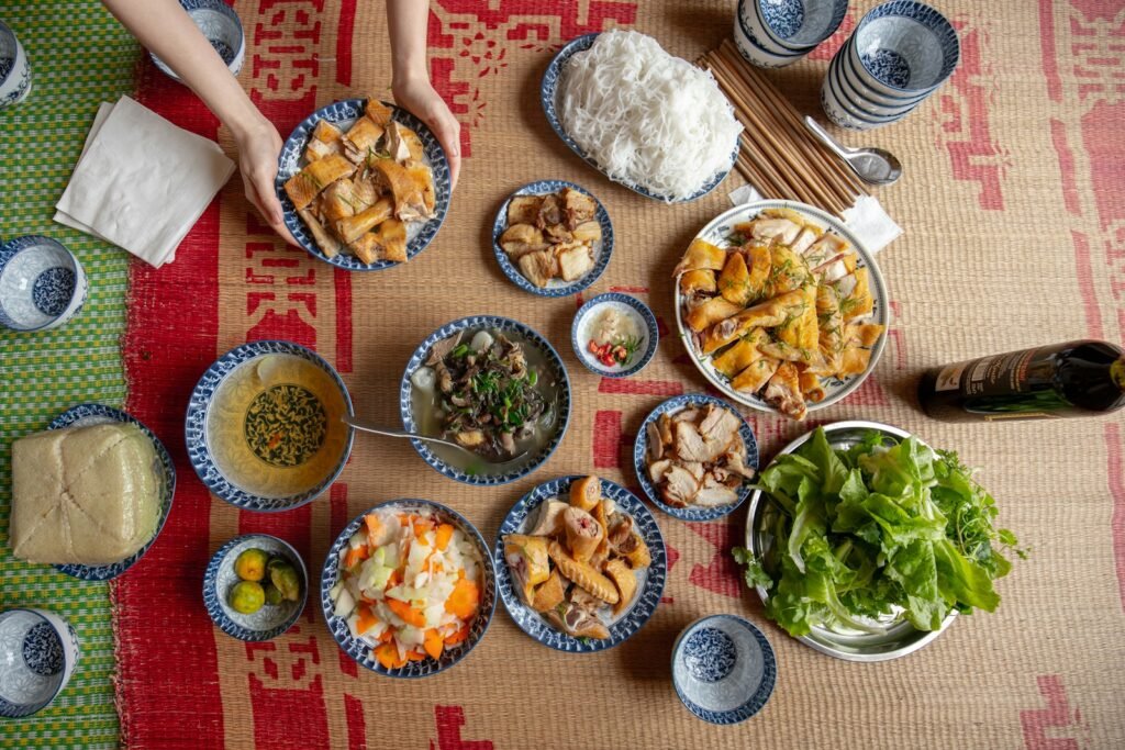 a table topped with bowls of food and plates of food