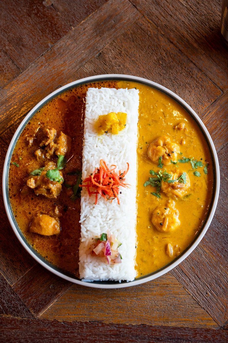 A bowl of food on a wooden table