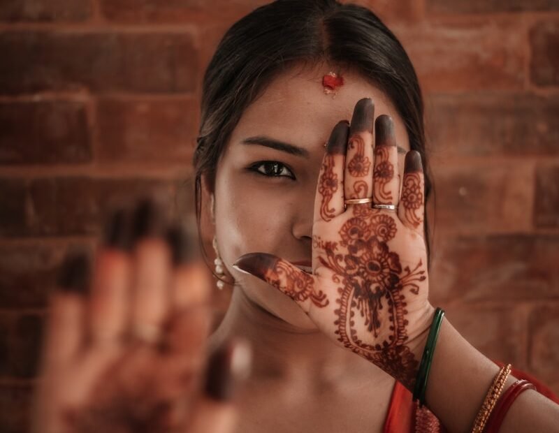 a woman with her hand on her face